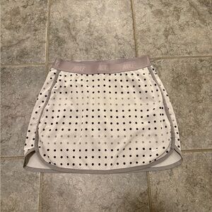 Classic Nike White Polka Dot Tennis Skort with Light Gray Waistband.